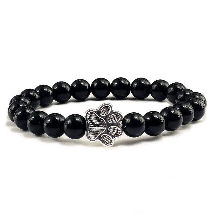 Tassunjäljen armbånd, dekorert med perler og delikat