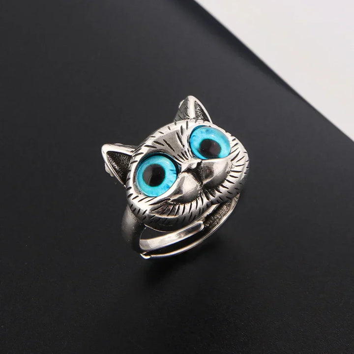 Leken ring med kattemotiv i blå detaljer
